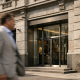 The facade of an Italian private bank building in a Milan financial district on a bright summer day