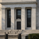 The Federal Reserve building facade in Washington under natural daylight, symbolising a US interest-rate decision