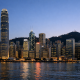 The Hong Kong financial district skyline at dusk, illustrating the city's currency peg to the US dollar