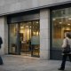 A modern Spanish bank branch facade in a European city, symbolising retail banking compliance and AML enforcement