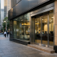 An Australian bank facade with signage for the Reserve Bank of Australia in the background under natural daylight
