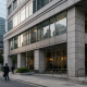 A Japanese bank facade in a Tokyo financial district under natural daylight