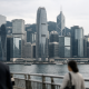 HKMA weighs tougher climate finance disclosures for banks 1 Hong Kong financial district skyline seen at eye level with bank towers under soft daylight