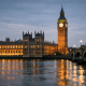 The Palace of Westminster seen across the River Thames, representing a UK parliamentary inquiry into banking access for crypto firms