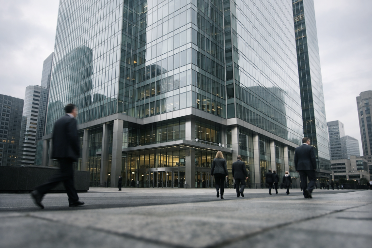 A modern London bank headquarters tower in the financial district under soft daylight