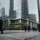 A modern London bank headquarters tower in the financial district under soft daylight