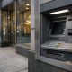 A Canadian bank facade and ATM in a downtown financial district under soft overcast light