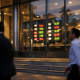 A Philippine bank facade and foreign-exchange board reflecting a central bank interest rate decision
