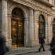 Facade of an Italian bank branch in a historic city centre, representing Monte dei Paschi di Siena's credit rating upgrade