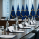 EU finance ministers meeting in Luxembourg with European flags and a modern conference setting