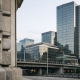 The facade of a Swiss financial regulator building in Zurich with the SIX Swiss Exchange skyline in the background