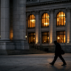 A quiet central bank facade at dusk symbolising global financial stability oversight