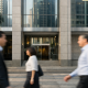 Exterior of a central bank building in Singapore's financial district under soft daylight