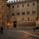 Historic Italian bank facade in Siena at dusk, symbolising a major banking consolidation moment