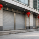 A modern Chinese bank facade with national flags during the National Day Golden Week holiday
