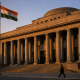 The facade of a central bank building in India with national flag at dusk